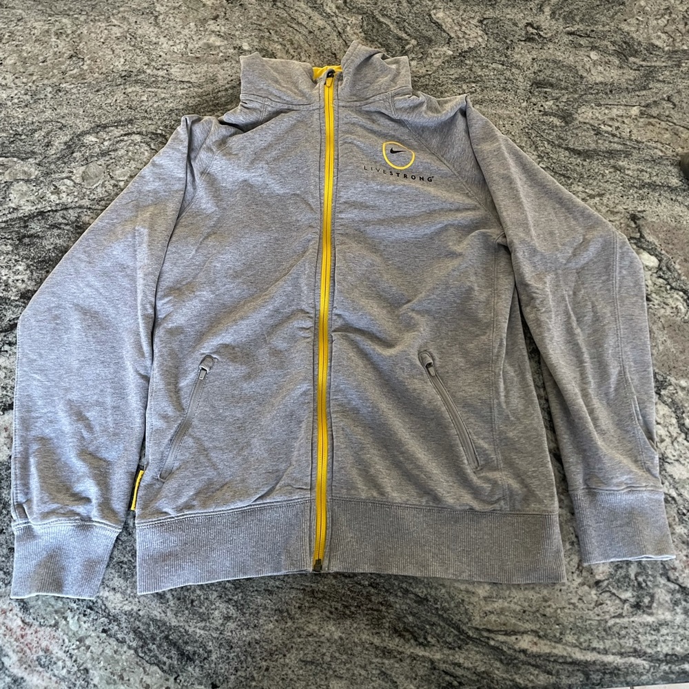 Vintage/retro 2000s Nike Livestrong hooded sweatshirt with zipper. Size Kids XL